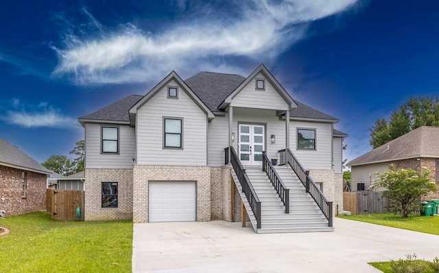 322 Spartan Loop, Slidell, LA 70458 - view of front of home with brick siding, stairway, concrete driveway, and a garage