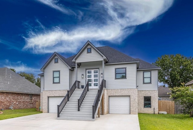 322 Spartan Loop, Slidell, LA 70458 - view of front of house featuring brick siding, a garage, and stairway
