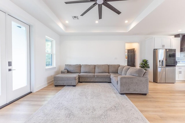 322 Spartan Loop, Slidell, LA 70458 - living room with a raised ceiling, ceiling fan, light wood-style floors, and recessed lighting