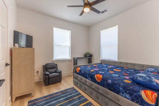 322 Spartan Loop, Slidell, LA 70458 - bedroom with wood finished floors, baseboards, and ceiling fan