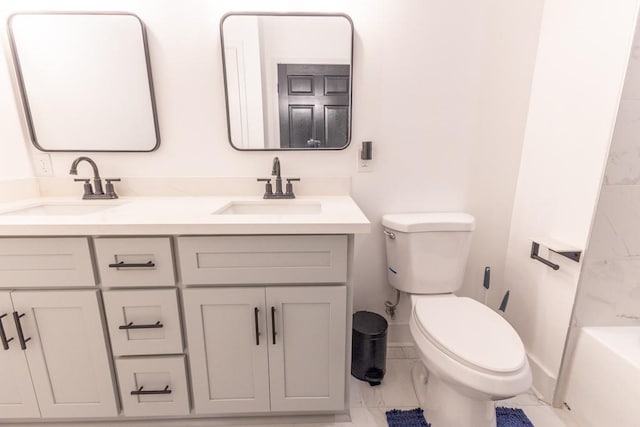 322 Spartan Loop, Slidell, LA 70458 - full bath featuring marble finish flooring, toilet, double vanity, baseboards, and a tub