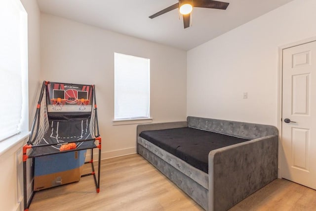 322 Spartan Loop, Slidell, LA 70458 - bedroom featuring wood finished floors, a ceiling fan, and baseboards