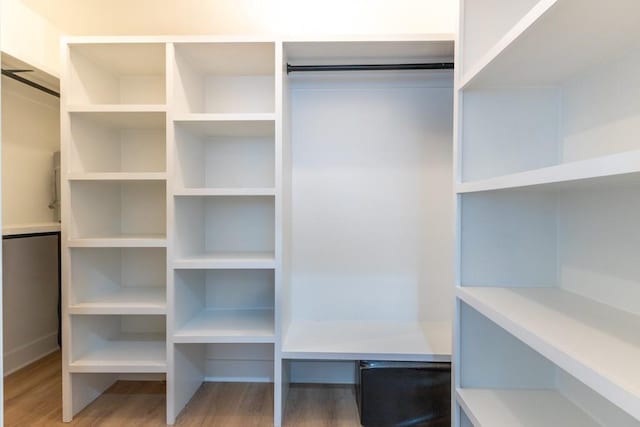 322 Spartan Loop, Slidell, LA 70458 - walk in closet featuring wood finished floors