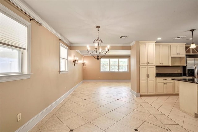 6219 Perlita Dr, New Orleans, LA 70122 - kitchen with stainless steel refrigerator with ice dispenser, crown molding, a chandelier, cream cabinetry, and baseboards