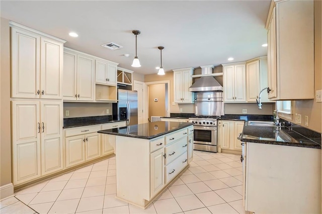 6219 Perlita Dr, New Orleans, LA 70122 - kitchen featuring appliances with stainless steel finishes, wall chimney exhaust hood, a kitchen island, recessed lighting, and open shelves