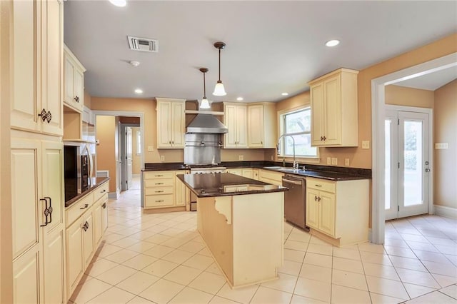 6219 Perlita Dr, New Orleans, LA 70122 - kitchen with dishwasher, stove, a sink, exhaust hood, and a kitchen island