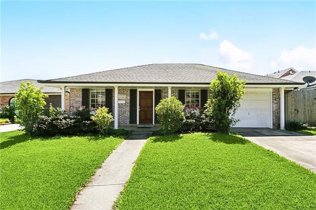 4804 Antonini Dr, Metairie, LA 70006 - ranch-style home with a garage, brick siding, and concrete driveway