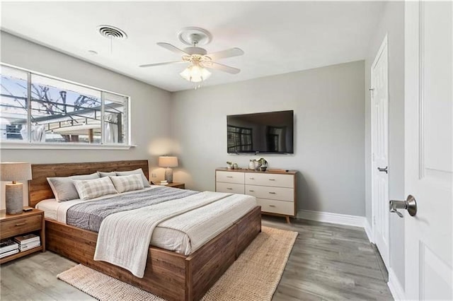 4804 Antonini Dr, Metairie, LA 70006 - bedroom with wood finished floors, baseboards, and ceiling fan