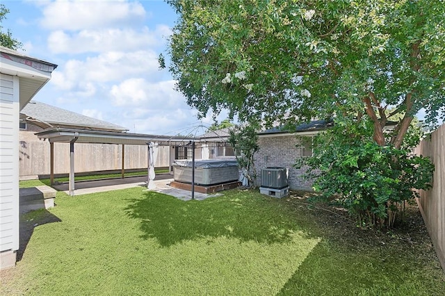 4804 Antonini Dr, Metairie, LA 70006 - view of yard featuring a hot tub, central air condition unit, a gazebo, and a patio area