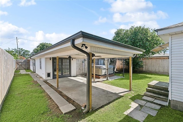 4804 Antonini Dr, Metairie, LA 70006 - rear view of property with a hot tub, a patio, a ceiling fan, a carport, and french doors