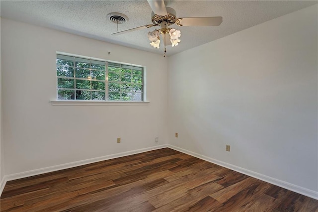 1569 Maplewood Dr, Slidell, LA 70458 - empty room featuring dark wood-type flooring, baseboards, and a ceiling fan