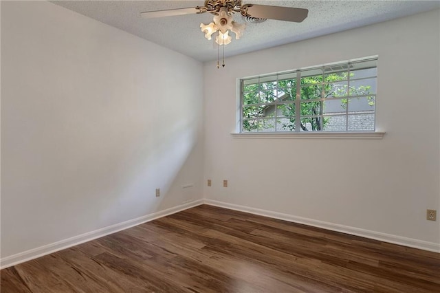 1569 Maplewood Dr, Slidell, LA 70458 - empty room with dark wood finished floors, ceiling fan, and baseboards