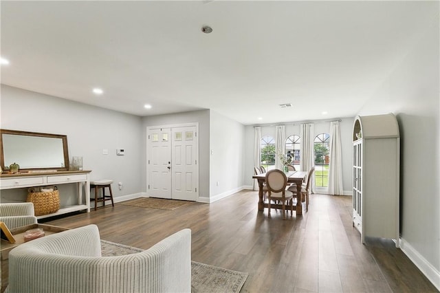 4320 Harvard Ave, Metairie, LA 70006 - living room with dark wood finished floors, recessed lighting, and baseboards