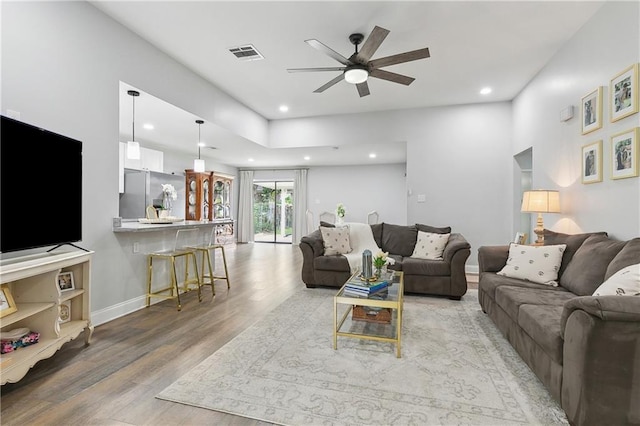 4320 Harvard Ave, Metairie, LA 70006 - living room featuring a ceiling fan, light wood-style floors, recessed lighting, and baseboards