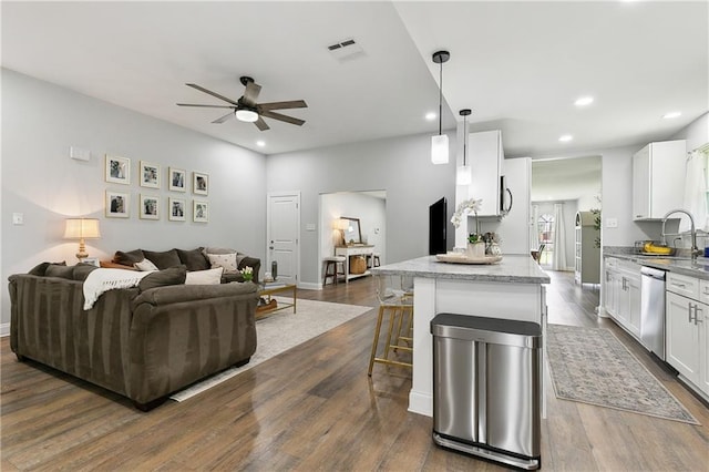 4320 Harvard Ave, Metairie, LA 70006 - living area with a ceiling fan, dark wood-style floors, recessed lighting, and baseboards
