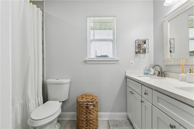 4320 Harvard Ave, Metairie, LA 70006 - full bath featuring baseboards, double vanity, toilet, and a shower with shower curtain