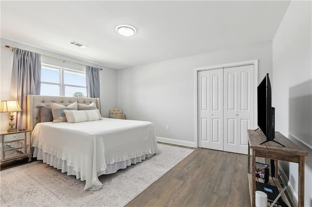 4320 Harvard Ave, Metairie, LA 70006 - bedroom featuring wood finished floors, baseboards, and a closet