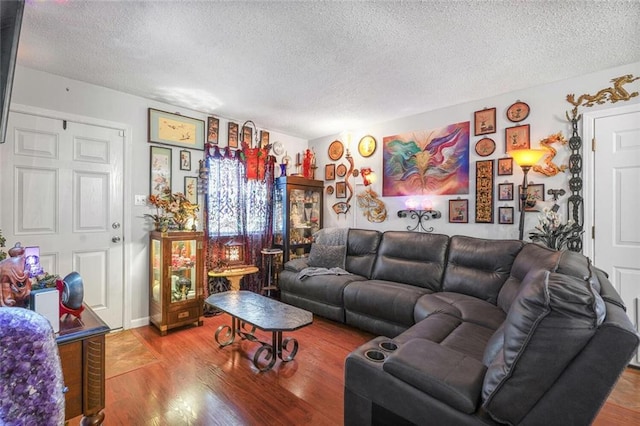 11 Richelle St, Waggaman, LA 70094 - living area featuring a textured ceiling and wood finished floors