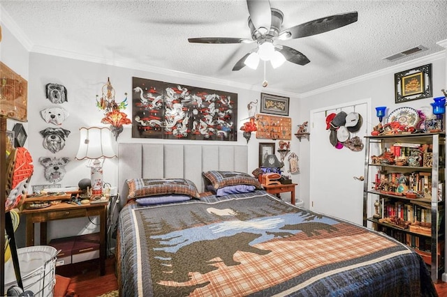11 Richelle St, Waggaman, LA 70094 - bedroom featuring ornamental molding, a textured ceiling, wood finished floors, and a ceiling fan