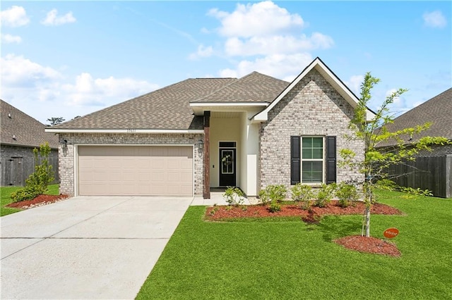 39651 Fairhope Dr, Ponchatoula, LA 70454 - view of front of property with a garage, driveway, a shingled roof, and brick siding