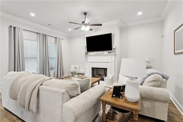 39651 Fairhope Dr, Ponchatoula, LA 70454 - living room with ceiling fan, a fireplace, wood finished floors, recessed lighting, and ornamental molding