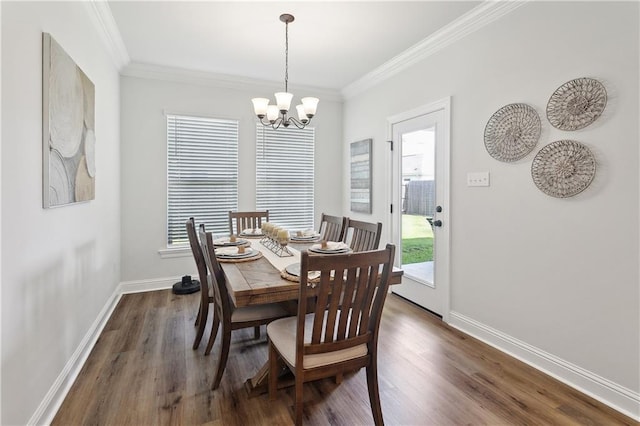 39651 Fairhope Dr, Ponchatoula, LA 70454 - dining room with a chandelier, ornamental molding, baseboards, and dark wood-type flooring