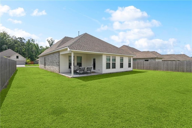 39651 Fairhope Dr, Ponchatoula, LA 70454 - back of property with a patio area and a shingled roof