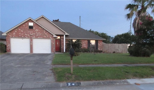 2 Tuscany Dr, La Place, LA 70068 - view of front of home with concrete driveway, brick siding, and an attached garage