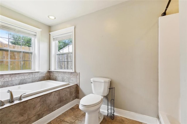 3405 Moss Ln, Violet, LA 70092 - bathroom with toilet, a bath, tile patterned flooring, and baseboards
