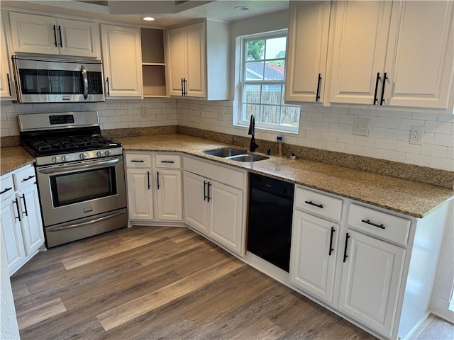 1005 David Dr, Metairie, LA 70003 - kitchen featuring stainless steel appliances, white cabinets, light wood-type flooring, open shelves, and recessed lighting