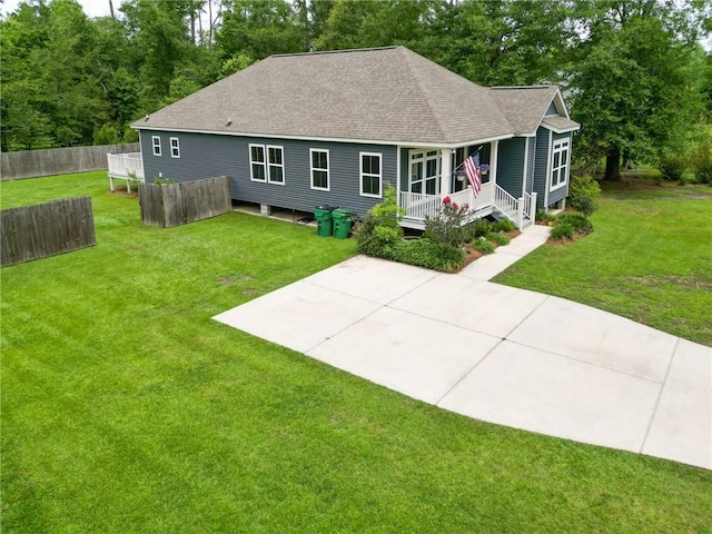 72163 Indian Trail Rd, Abita Springs, LA 70420 - back of property with roof with shingles, covered porch, and a patio