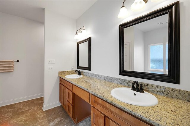 72163 Indian Trail Rd, Abita Springs, LA 70420 - bathroom with double vanity, baseboards, and tile patterned floors