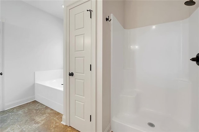 72163 Indian Trail Rd, Abita Springs, LA 70420 - full bath featuring baseboards, a shower, and a bath