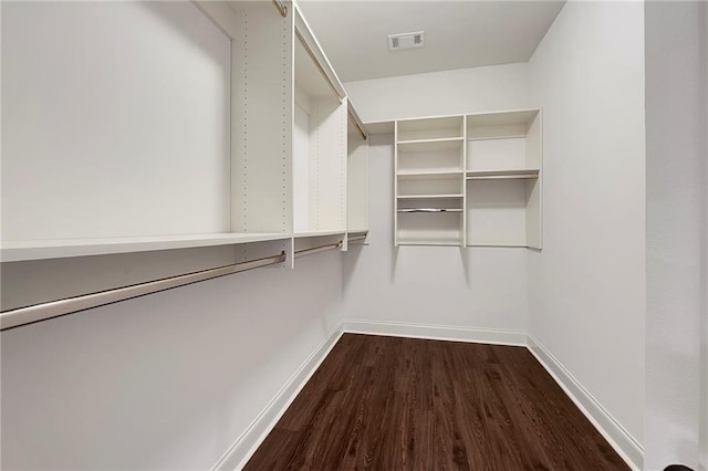 72163 Indian Trail Rd, Abita Springs, LA 70420 - walk in closet featuring dark wood finished floors