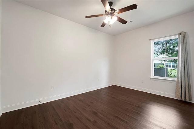 72163 Indian Trail Rd, Abita Springs, LA 70420 - empty room with baseboards, dark wood-style flooring, and a ceiling fan