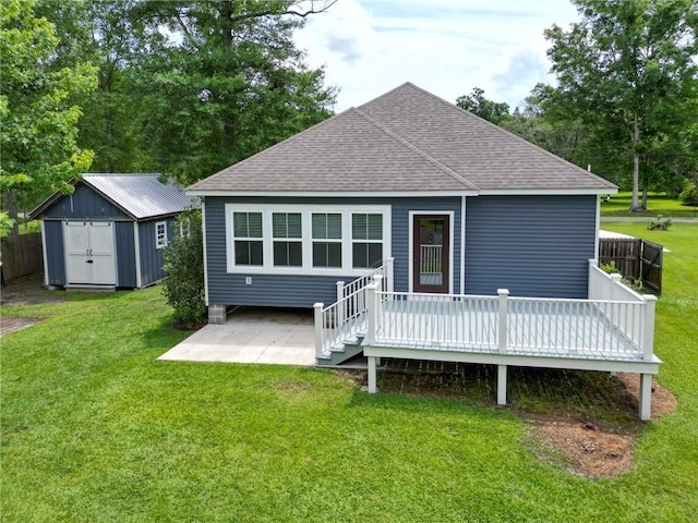 72163 Indian Trail Rd, Abita Springs, LA 70420 - back of property with roof with shingles, a wooden deck, and a patio