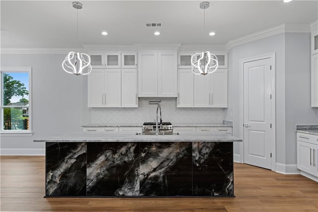1208 Lucille Ave, Metairie, LA 70003 - kitchen featuring a chandelier, baseboards, backsplash, crown molding, and recessed lighting