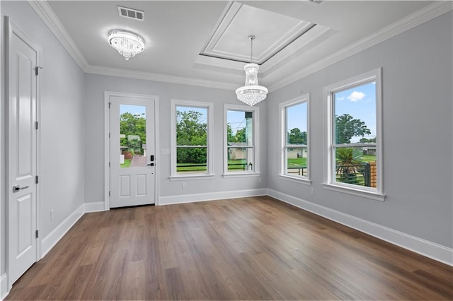 1208 Lucille Ave, Metairie, LA 70003 - foyer entrance with a chandelier, dark wood-style floors, ornamental molding, and baseboards