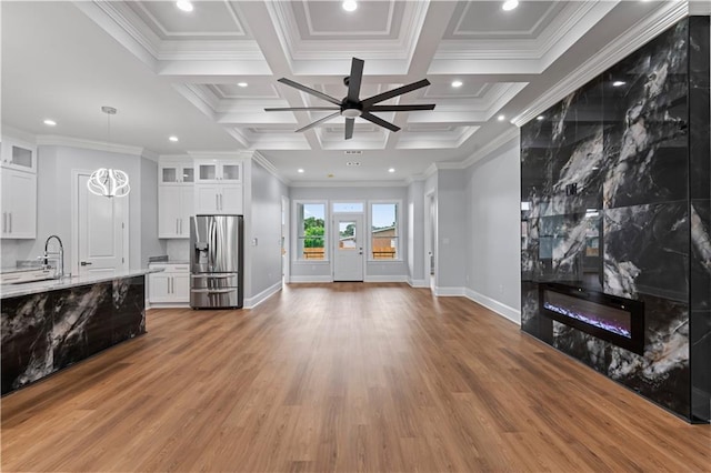 1208 Lucille Ave, Metairie, LA 70003 - unfurnished living room with ceiling fan, light wood-type flooring, a sink, a large fireplace, and ornamental molding