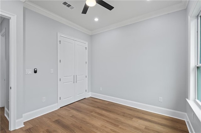 1208 Lucille Ave, Metairie, LA 70003 - unfurnished bedroom featuring ornamental molding, wood finished floors, baseboards, recessed lighting, and a ceiling fan