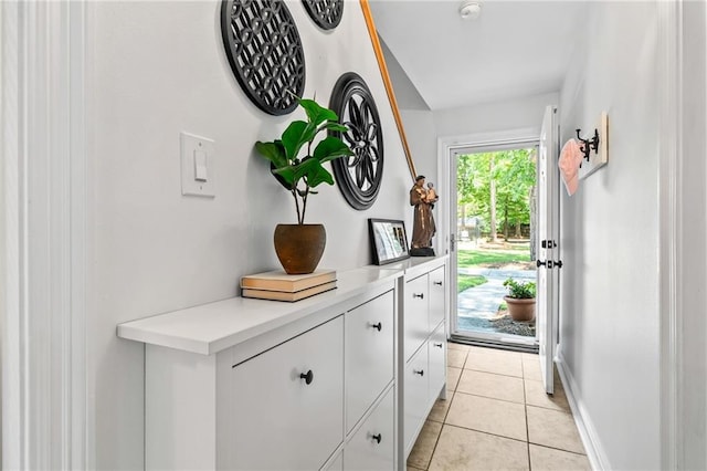 120 W Pineridge St Unit 120, Mandeville, LA 70448 - entryway featuring light tile patterned flooring and baseboards