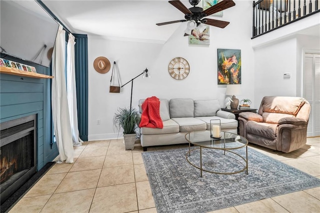 120 W Pineridge St Unit 120, Mandeville, LA 70448 - living area with a ceiling fan, a warm lit fireplace, and tile patterned floors
