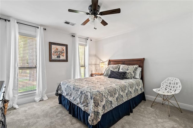 120 W Pineridge St Unit 120, Mandeville, LA 70448 - bedroom featuring light colored carpet, crown molding, and a ceiling fan