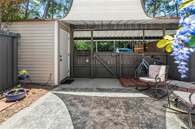 120 W Pineridge St Unit 120, Mandeville, LA 70448 - view of patio featuring a gate