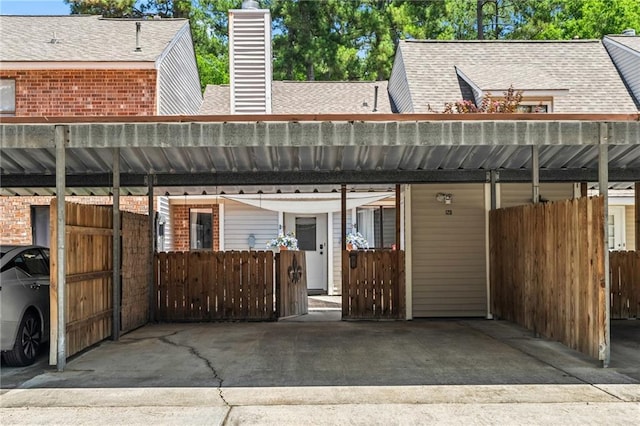 120 W Pineridge St Unit 120, Mandeville, LA 70448 - back of house with a shingled roof, a chimney, and brick siding