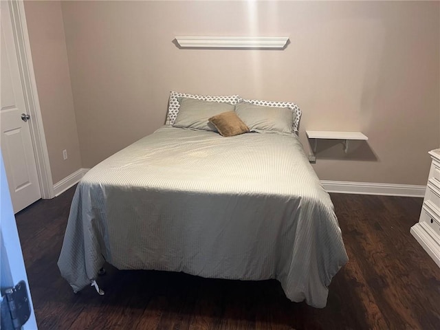 4441 Burbank Dr Unit 308, Baton Rouge, LA 70820 - bedroom with baseboards and dark wood-style flooring