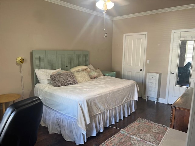 4441 Burbank Dr Unit 308, Baton Rouge, LA 70820 - bedroom featuring ornamental molding, dark wood finished floors, and baseboards