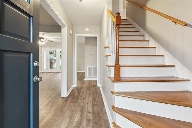 4509 Purdue Dr, Metairie, LA 70003 - stairway featuring wood finished floors, a ceiling fan, and baseboards
