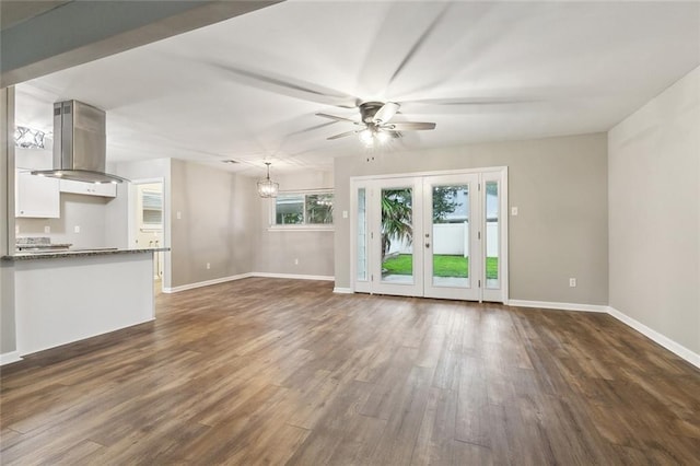 4509 Purdue Dr, Metairie, LA 70003 - unfurnished living room featuring ceiling fan, dark wood finished floors, baseboards, and french doors