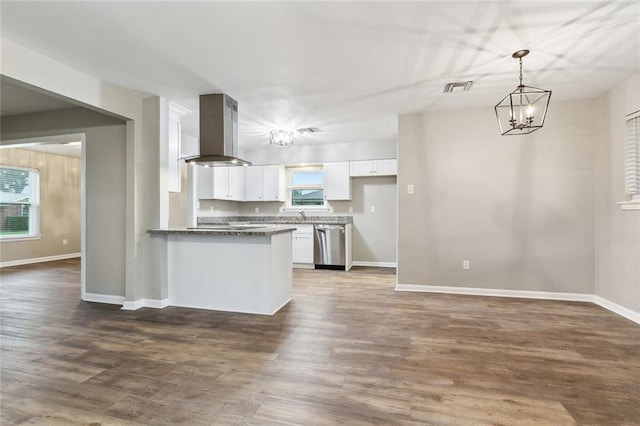 4509 Purdue Dr, Metairie, LA 70003 - kitchen with island exhaust hood, dishwasher, white cabinets, a chandelier, and baseboards